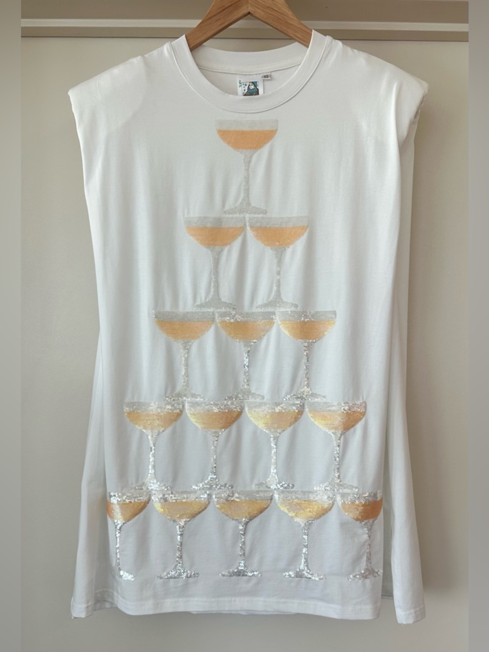 Queen of Sparkles Champagne Tower Shoulder Pad Dress. Size XS